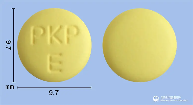 라니몬정 앞뒤 사진 (노란색 원형, 각인 PKP E)