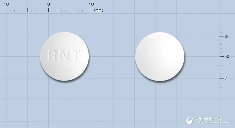 라니타드정 앞뒤 사진 (흰색 원형, 각인 RNT)