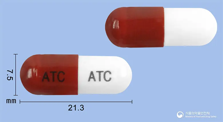 한신안티캄캡슐(은교산) 앞뒤 사진 (빨간색 캡슐, 각인 ATC ATC)