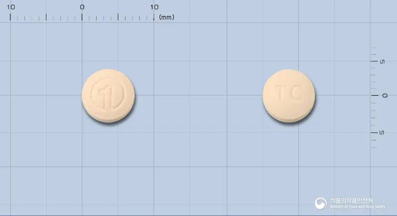 치오신정 앞뒤 사진 (분홍색 원형, 각인 TC)