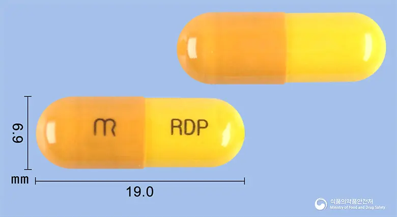 로이디펜캡슐 앞뒤 사진 (갈색 캡슐, 각인 RDP)