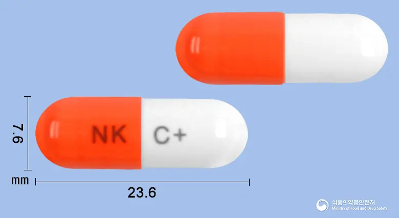 콜드플러스캡슐 앞뒤 사진 (주황색 캡슐, 각인 NK C+)