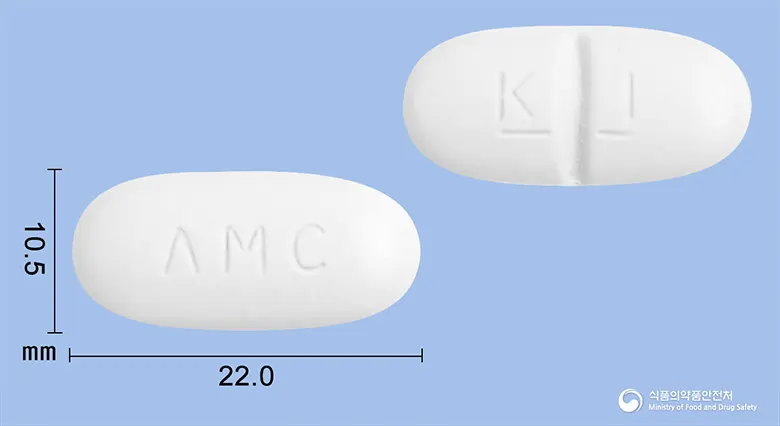 아모크라듀오정1000mg(아목시실린-클라불란산칼륨(7:1))(수출명:서프렌틴듀오정) 앞뒤 사진 (흰색 장방형, 각인 ΛMC / K I- -)