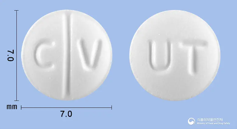 카베돌정(카르베딜롤) 앞뒤 사진 (흰색 원형, 각인 C V / UT)