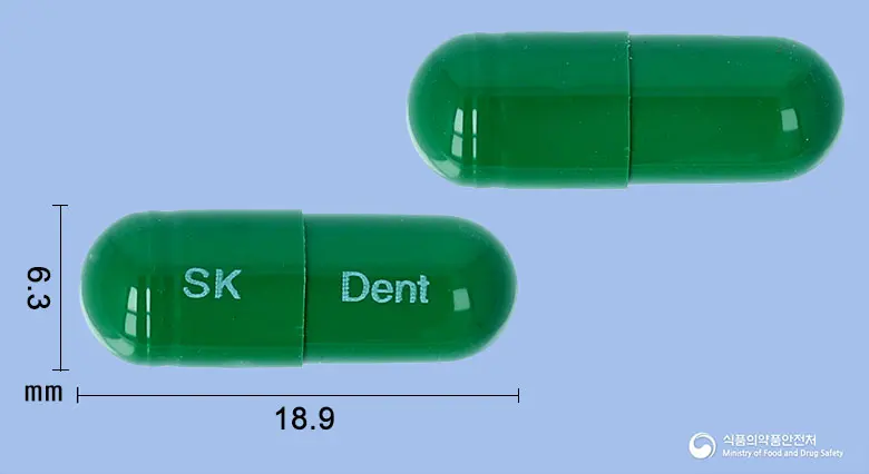 덴스롤캡슐 앞뒤 사진 (초록색 캡슐, 각인 SK Dent)