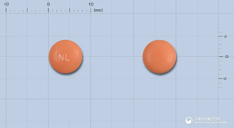 네프마린정(수출용) 앞뒤 사진 (주황색 원형, 각인 NL)