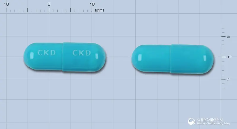 투스딘골드캡슐 앞뒤 사진 (파란색 캡슐, 각인 CKD CKD)