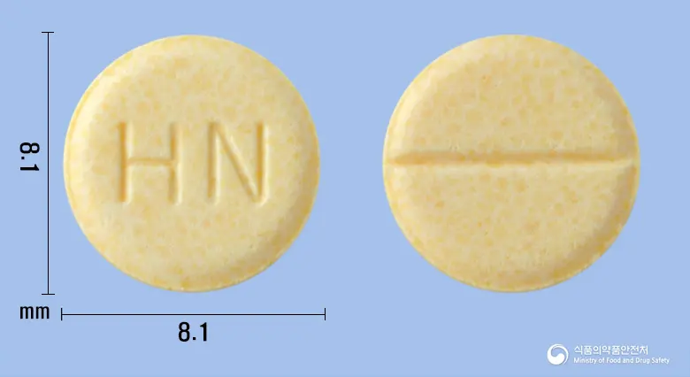 하이네콜정(베타네콜염화물) 앞뒤 사진 (노란색 원형, 각인 HN)