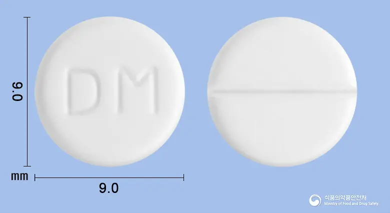 마이부틴정(트리메부틴말레산염) 앞뒤 사진 (흰색 원형, 각인 DM)