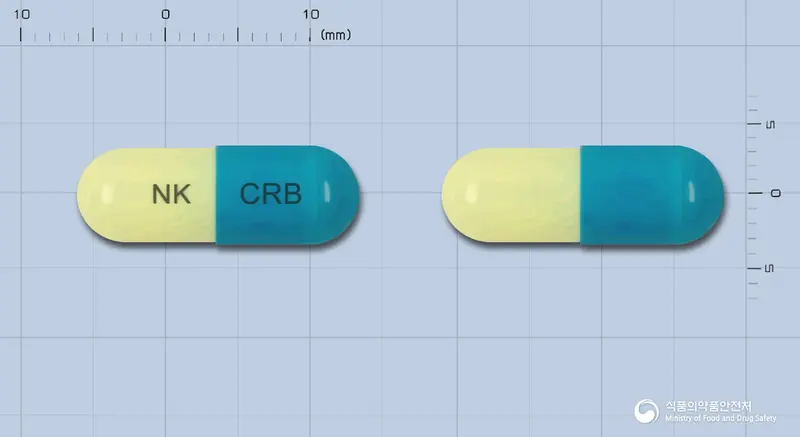 크레보캅셀 앞뒤 사진 (파란색 캡슐, 각인 NK CRB)