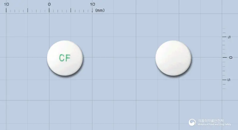 케어탈정(아세클로페낙) 앞뒤 사진 (흰색 원형, 각인 CF)