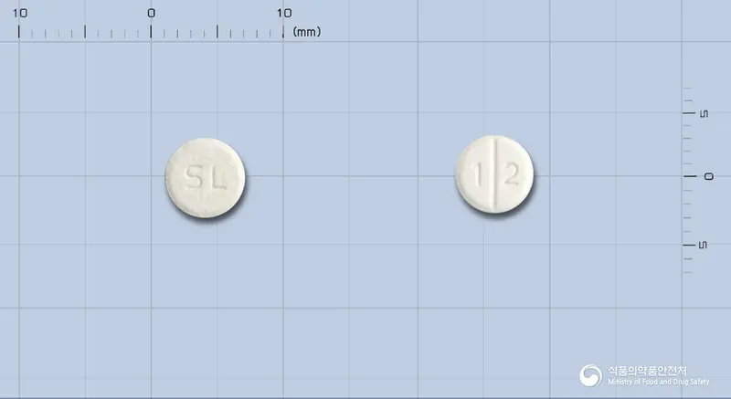 에이프로젠카르베딜롤정 앞뒤 사진 (흰색 원형, 각인 SL / 1 2)