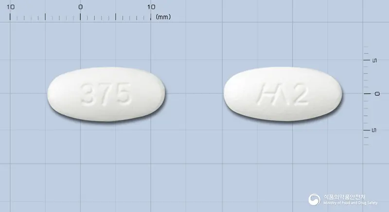 나노크라정375mg[아목시실린,클라불란산칼륨(2:1)] 앞뒤 사진 (흰색 타원형, 각인 375 / 2)