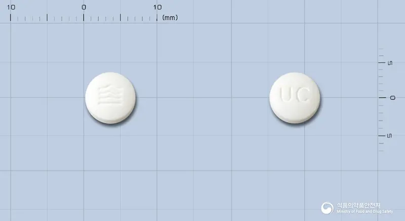 유로콘정(프로피베린염산염) 앞뒤 사진 (흰색 원형, 각인 UC)