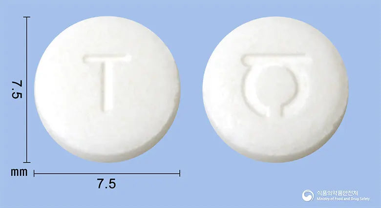 탐로신서방정(탐스로신염산염) 앞뒤 사진 (흰색 원형, 각인 T)
