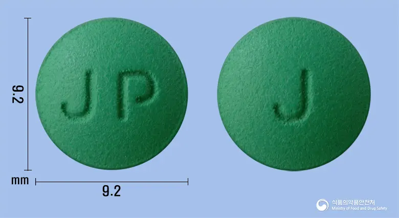 징코크린정120mg(은행엽건조엑스) 앞뒤 사진 (초록색 원형, 각인 JP / J)