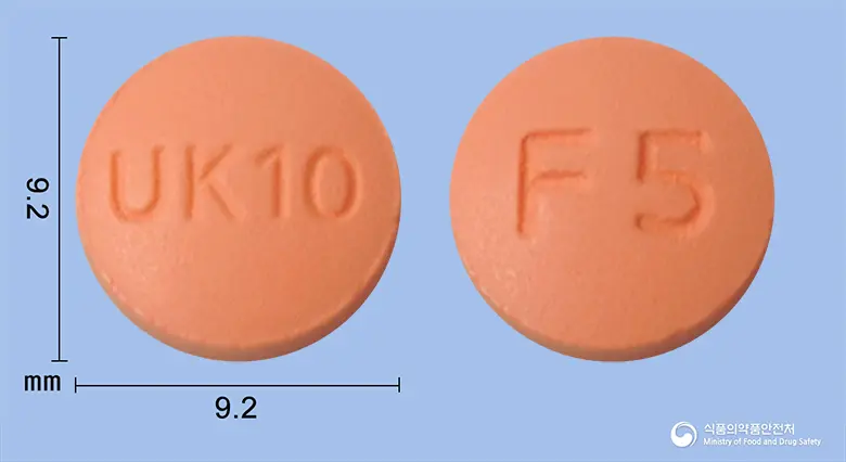 펠디핀정(펠로디핀) 앞뒤 사진 (분홍색 원형, 각인 UK10 / F5)