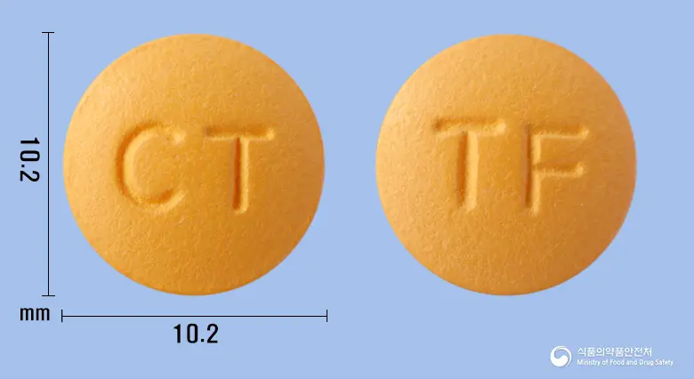포탈정(탈니플루메이트) 앞뒤 사진 (주황색 원형, 각인 CT / TF)