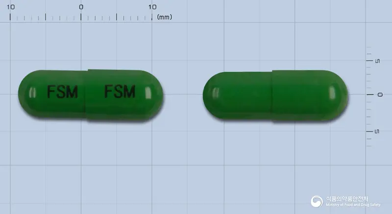 한신후레시모닝캡슐 앞뒤 사진 (초록색 캡슐, 각인 FSM FSM)