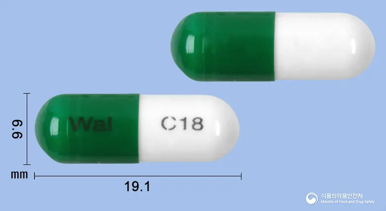 디펜돌캡슐(치모모둘린)(수출용)(수출명:Dafendol Capsule, Epidolle Capsule, Immutes Capsule) 앞뒤 사진 (초록색 캡슐, 각인 Wal C18)