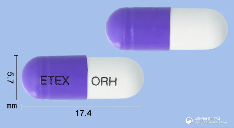 오라클러캡슐250mg(세파클러수화물) 앞뒤 사진 (보라색 캡슐, 각인 ETEX ORH)