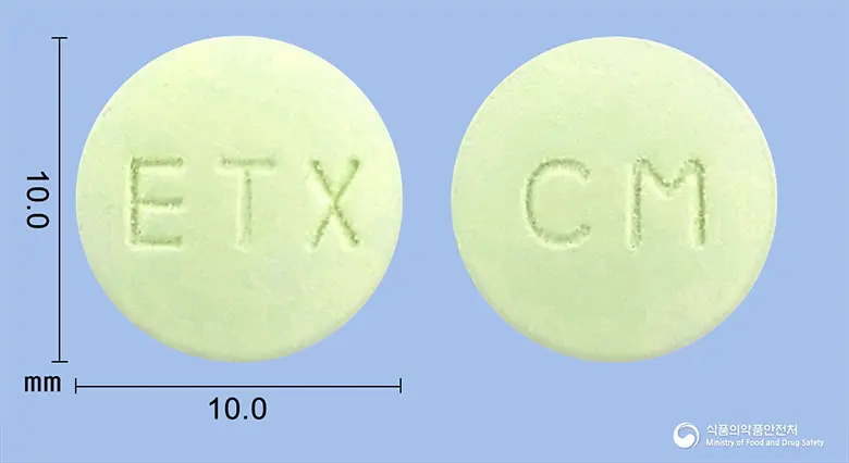 이텍스시메티딘정(시메티딘) 앞뒤 사진 (연두색 원형, 각인 ETX / CM)