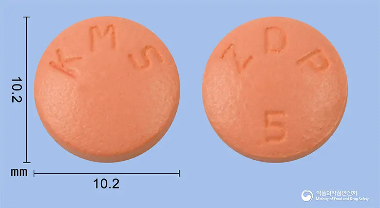 지로디핀지속정(펠로디핀) 앞뒤 사진 (분홍색 원형, 각인 KMS / ZDP 5)