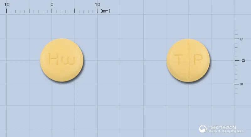 토팜정(토피라메이트) 앞뒤 사진 (노란색 원형, 각인 T P)