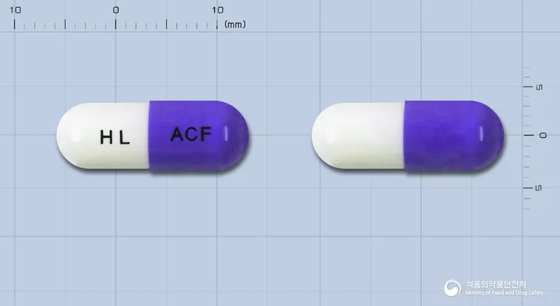 올세파캡슐(세파클러수화물) 앞뒤 사진 (보라색 캡슐, 각인 HL ACF)