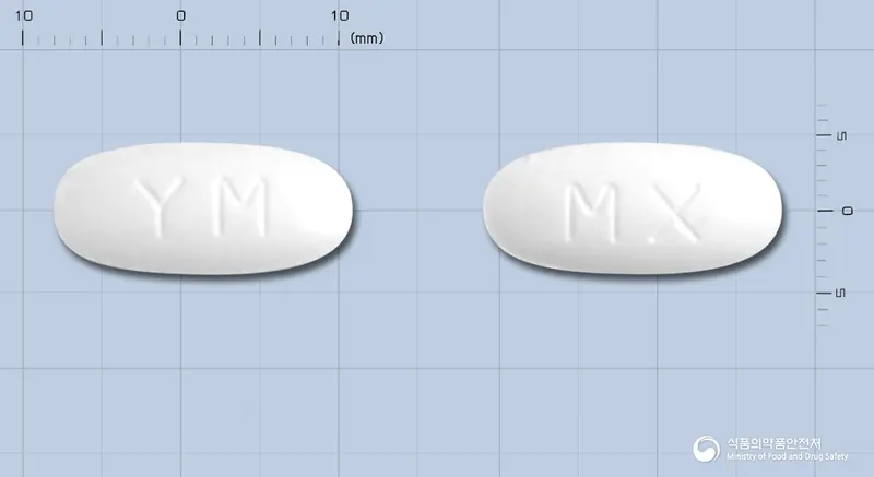 메타렉스정 앞뒤 사진 (흰색 타원형, 각인 YM / MX)