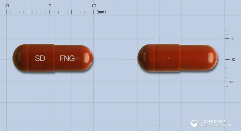 훼너지캡슐 앞뒤 사진 (갈색 캡슐, 각인 SD FNG)