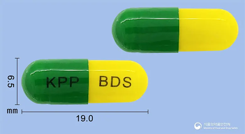 비도스캡슐(에르도스테인) 앞뒤 사진 (초록색 캡슐, 각인 KPP BDS)