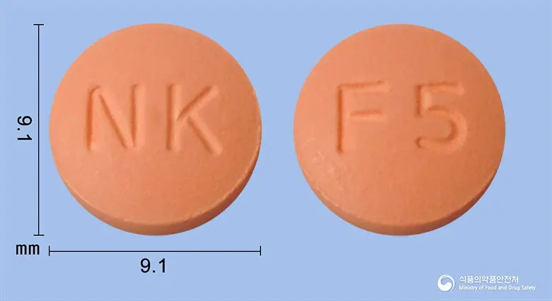 할로핀정(펠로디핀) 앞뒤 사진 (분홍색 원형, 각인 NK / F5)
