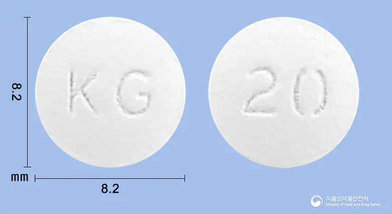 파몬딘정(파모티딘) 앞뒤 사진 (흰색 원형, 각인 KG / 20)