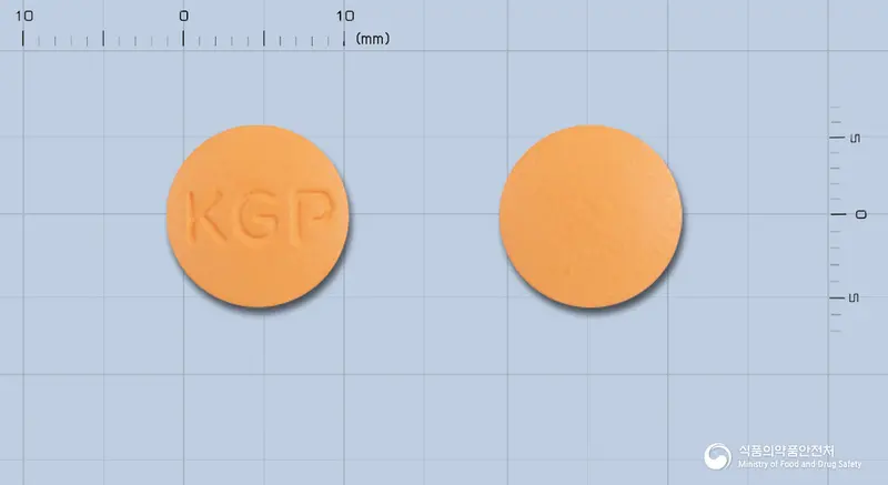 트리메정(탈니플루메이트) 앞뒤 사진 (주황색 원형, 각인 KGP)
