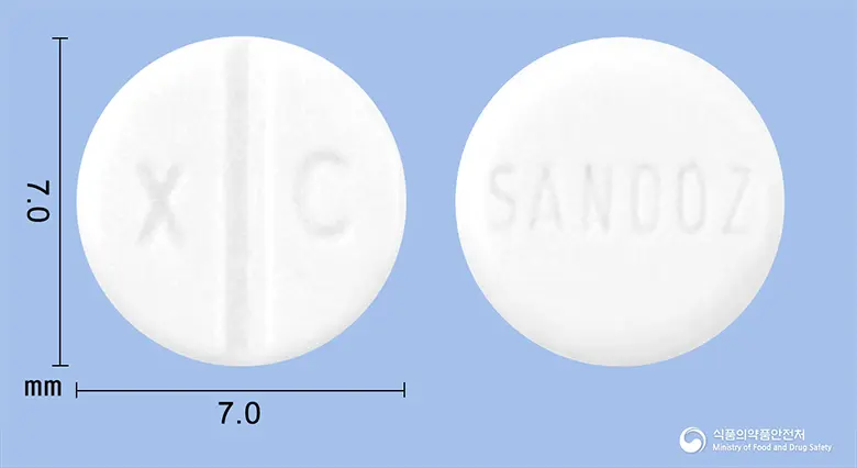 팔로델정(브로모크립틴메실산염) 앞뒤 사진 (흰색 원형, 각인 X C / SANDOZ)