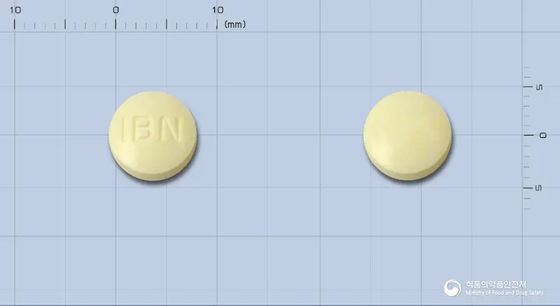 바세릭정10/25mg[수출명:인바이오넷바세릭정10/25mg] 앞뒤 사진 (노란색 원형, 각인 IBN)