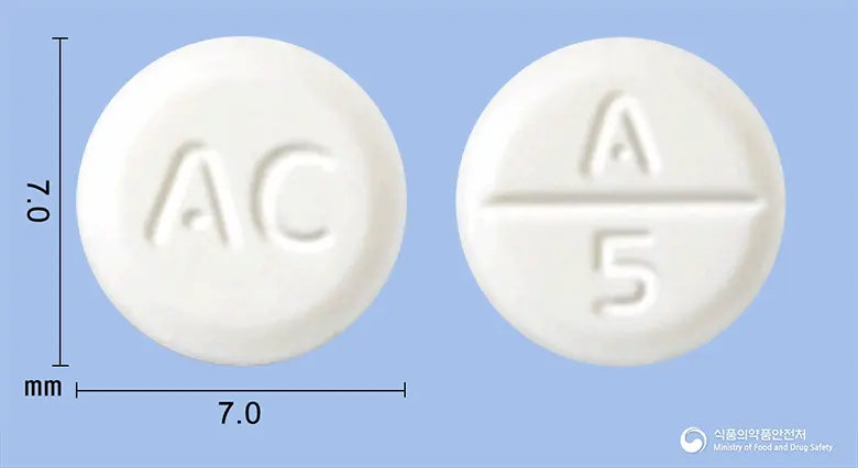 알베롤정(카르베딜롤) 앞뒤 사진 (흰색 원형, 각인 AC / A 5)