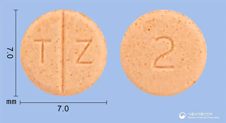 테라젠정2mg(테라조신염산염수화물) 앞뒤 사진 (분홍색 원형, 각인 T Z / 2)