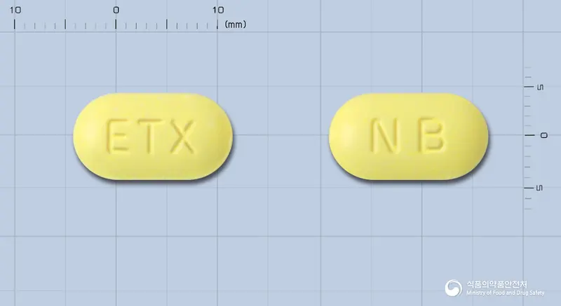 이텍스나부메톤정500mg 앞뒤 사진 (노란색 타원형, 각인 ETX / NB)