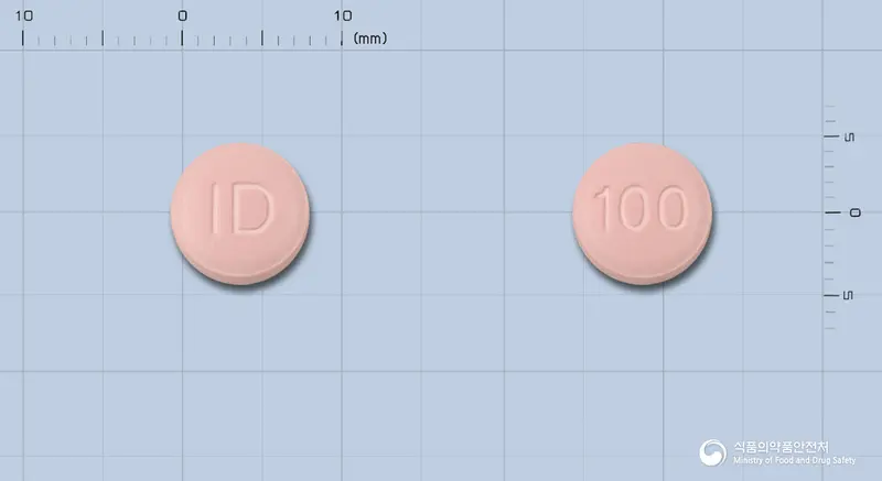 후로목스정100밀리그램(세프카펜피복실염산염수화물) 앞뒤 사진 (분홍색 원형, 각인 ID / 100)