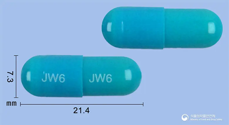 덴치로캡슐(청위산) 앞뒤 사진 (파란색 캡슐, 각인 JW6 JW6)
