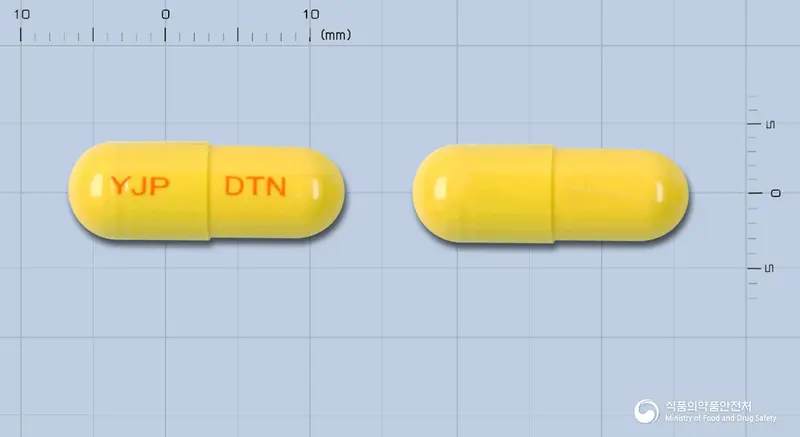 덴티나인캡슐 앞뒤 사진 (노란색 캡슐, 각인 YJP DTN)