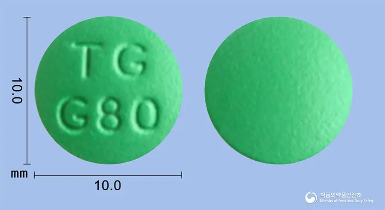긴코센정80밀리그램(은행엽건조엑스)(수출명 : GINBEMEX TABLET 80MG) 앞뒤 사진 (초록색 원형, 각인 TGG80)