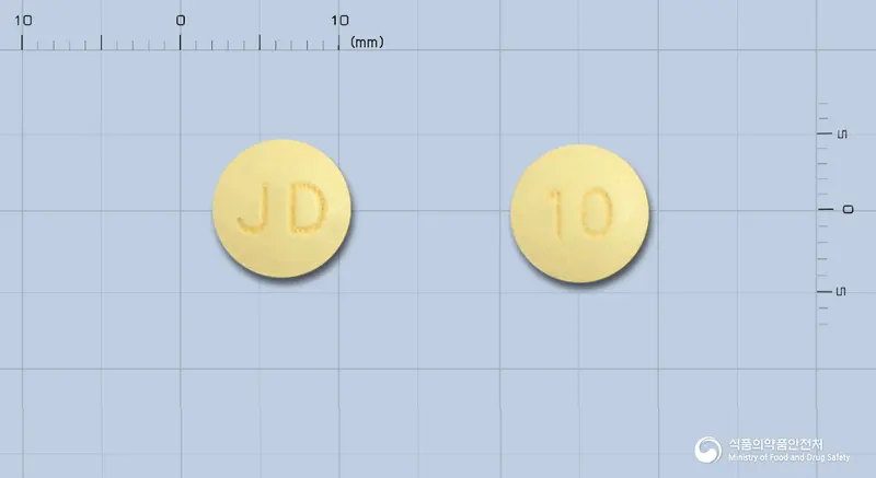 도나셉트정(도네페질염산염) 앞뒤 사진 (노란색 원형, 각인 JD / 10)