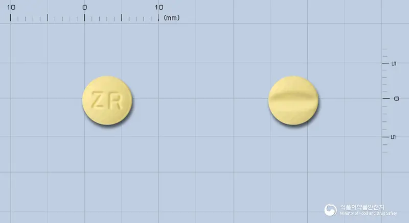 자니카정(염산레르카니디핀) 앞뒤 사진 (노란색 원형, 각인 ZR)