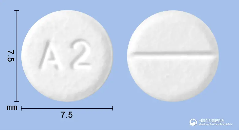 알파디롤정(카르베딜롤) 앞뒤 사진 (흰색 원형, 각인 A2)