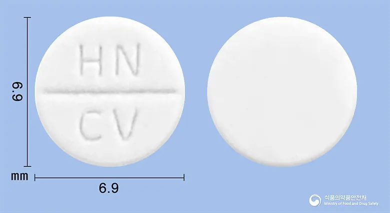 카베트렌정(카르베딜롤) 앞뒤 사진 (흰색 원형, 각인 HN CV)