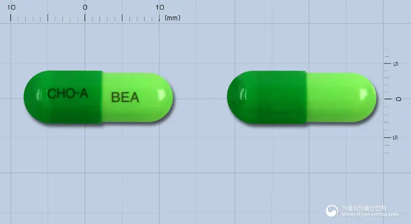 뷰스타캡슐 앞뒤 사진 (초록색 캡슐, 각인 CHO-A BEA)