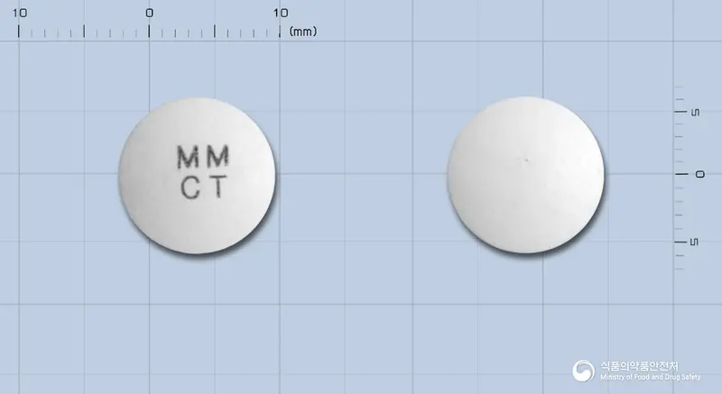 카르틴정330밀리그람(엘-카르니틴)(수출용) 앞뒤 사진 (흰색 원형, 각인 MMCT)